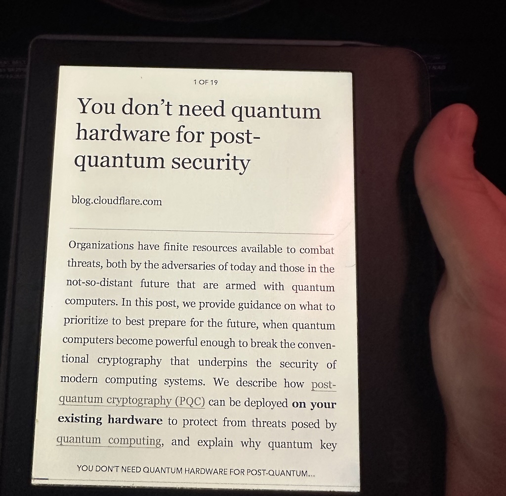 A photo of a Kobo eReader on a Ryanair flight with an article by Cloudflare on Quantum Cryptography.